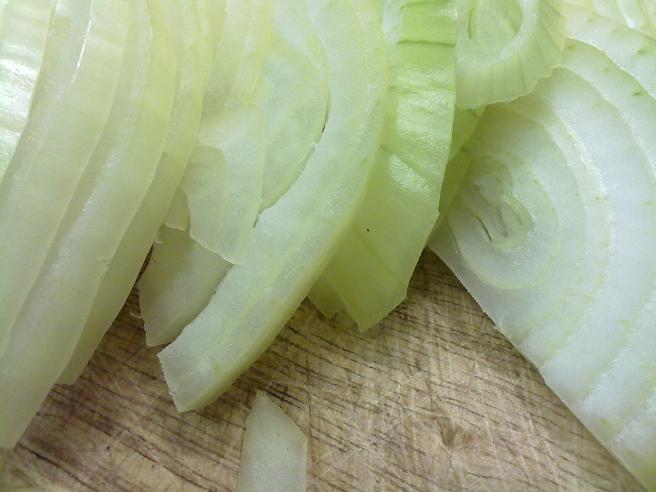 Cut onions in half then slice thinly