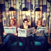 Checking out the business news under the bowler hat lights (thanks to Laura for this pic)