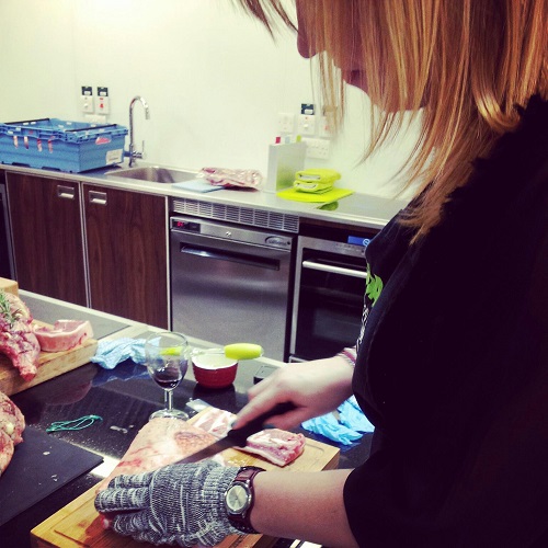 Laura boning the lamb