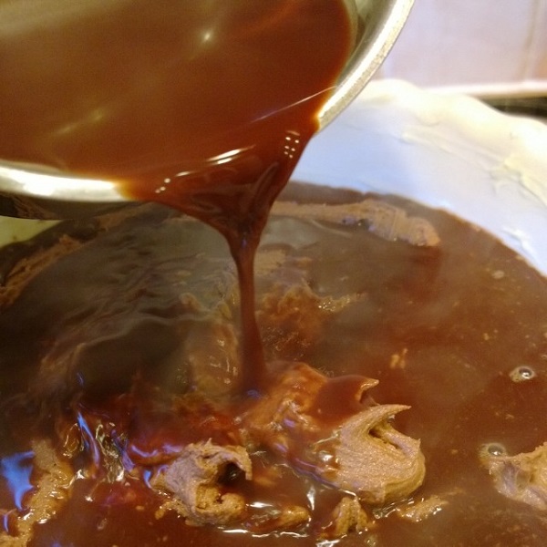 Pour the chocolate sauce over the cake batter