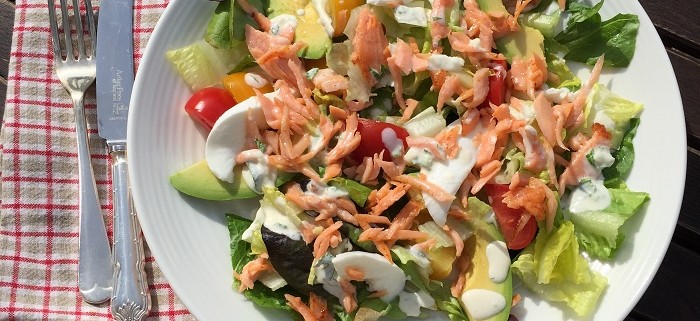 Smoked salmon and avocado salad with herby crème fraîche dressing