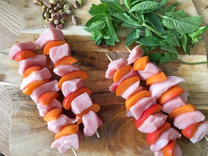 Making the pork and apricot kebabs
