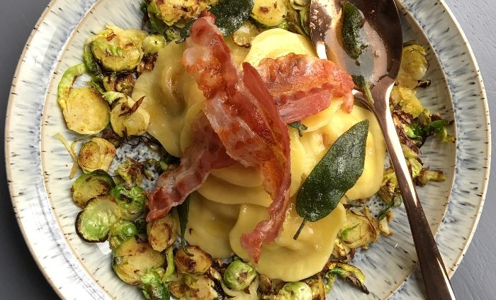 Festive ravioli with sage butter, shredded sprouts and pancetta