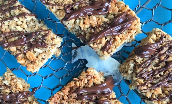 Coconut and chia seed granola bars with chocolate drizzle