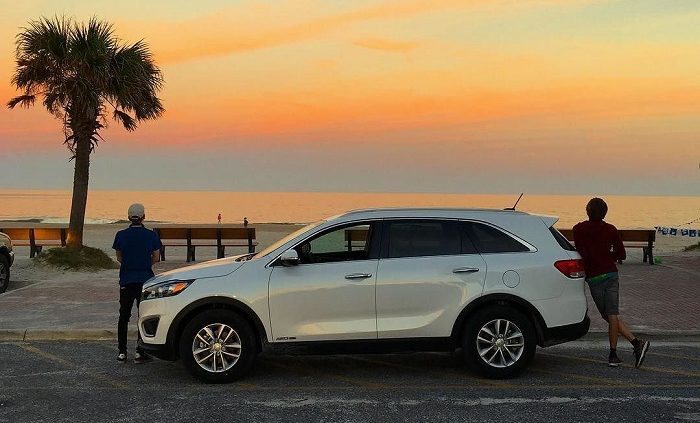 Out and about on Amelia Island: the boys with our beautiful pearly Hertz 4x4