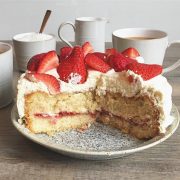 Strawberry and Cointreau layer cake with coconut cream
