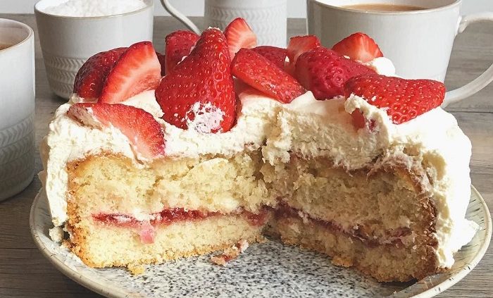 Strawberry and Cointreau layer cake with coconut cream