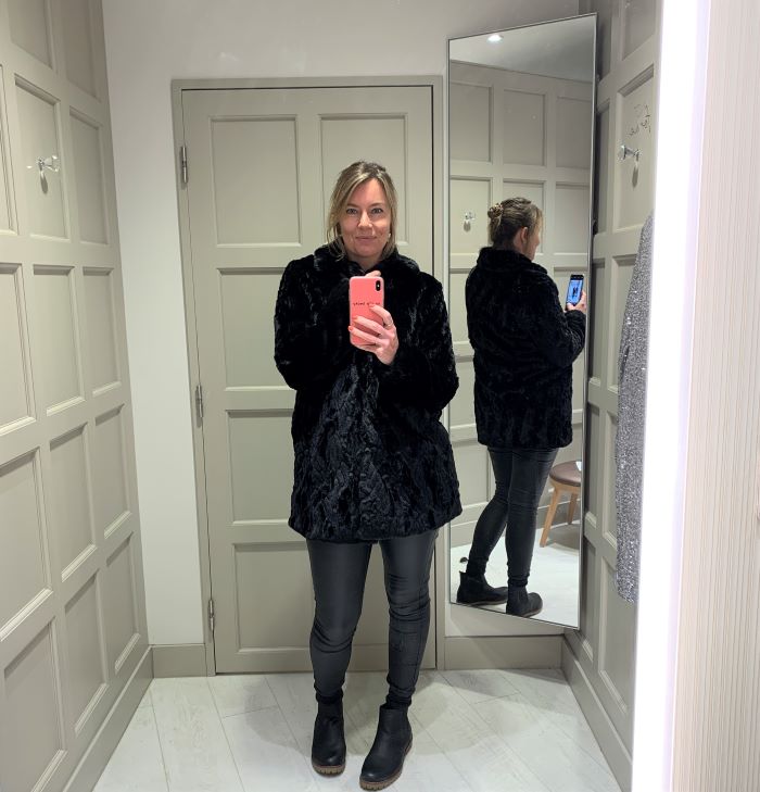 Black textured faux fur coat