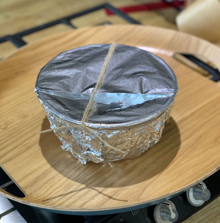 The wrapped Christmas pud ready for steaming