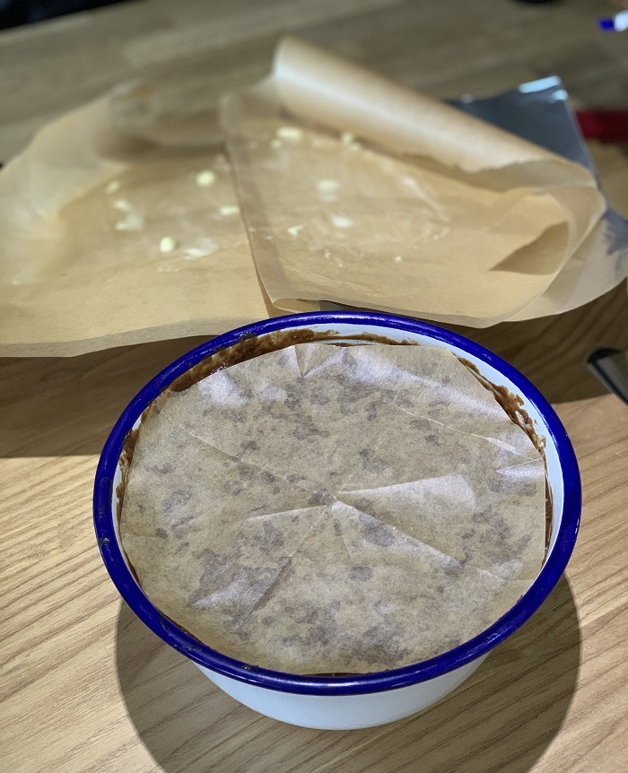 Wrapping the Christmas pudding ready for steaming