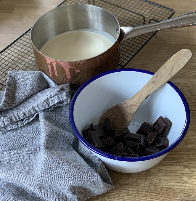 Pour the warmed cream over the chocolate