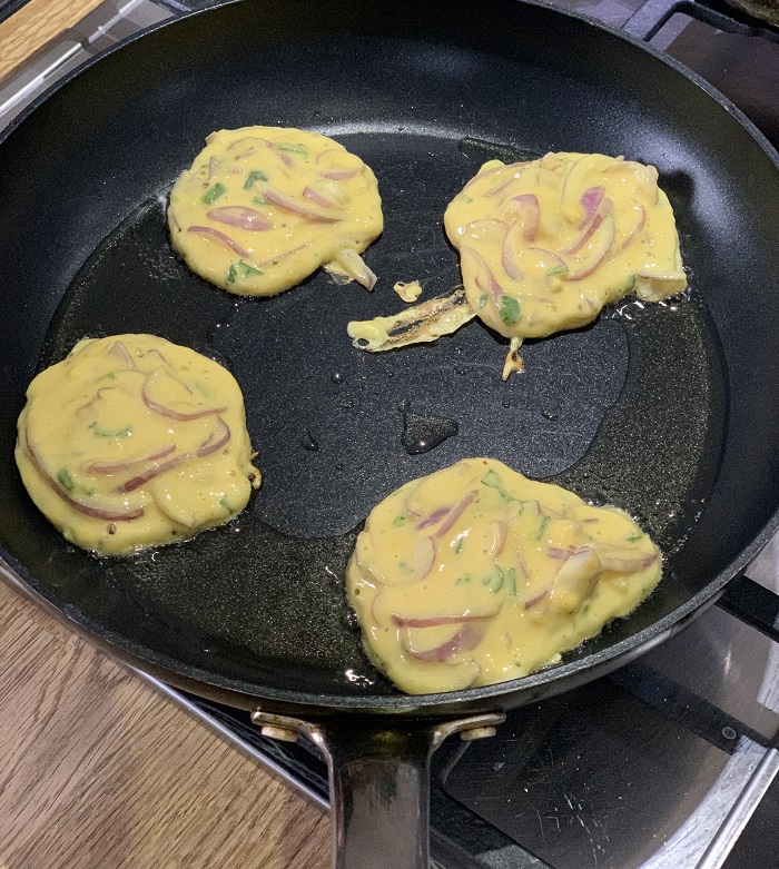 Spiced coconut veggie stew and onion fritters