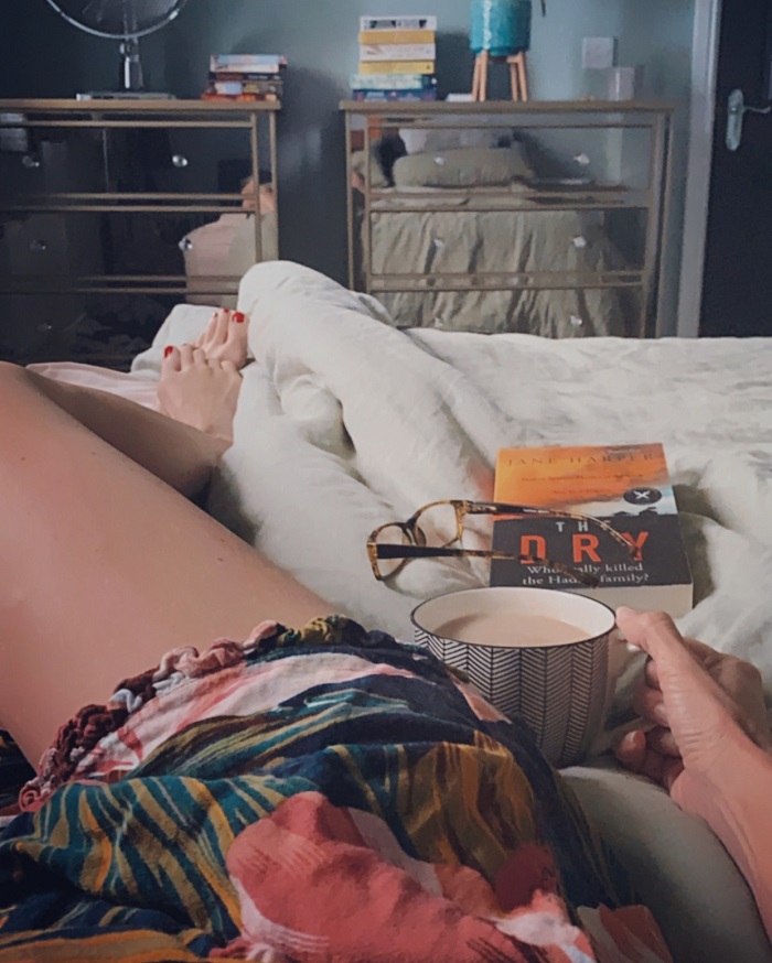 Tea in bed and piles of books